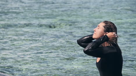 woman in wetsuit enjoying the ocean