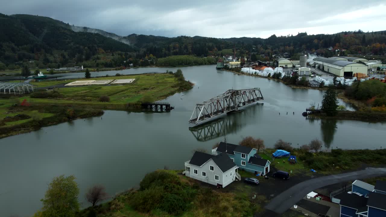 US, WA, Raymond, 2025-10-25 - Drone view of the abandoned train trestle rotating bridge on the Willapa River