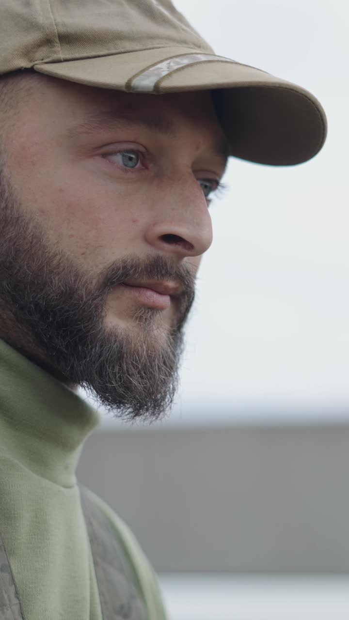 Portrait of a bearded man in a cap