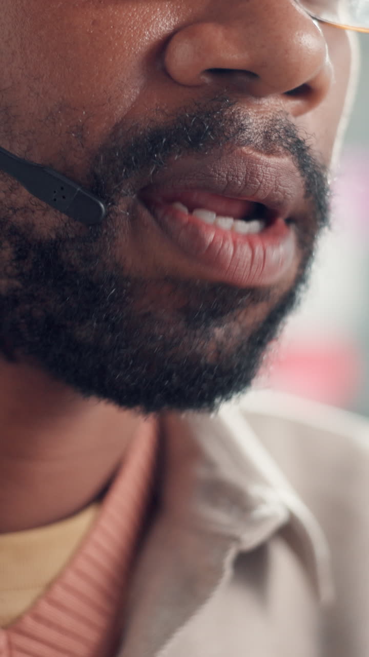 Close-Up of Man with Headset Speaking into Microphone