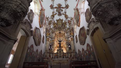 wide low-angle push-in shot inside the church of saint francis of assisi, highlighting the intricate altar details in ouro preto, minas gerais, brazil (ouro preto, minas gerais, brasil)