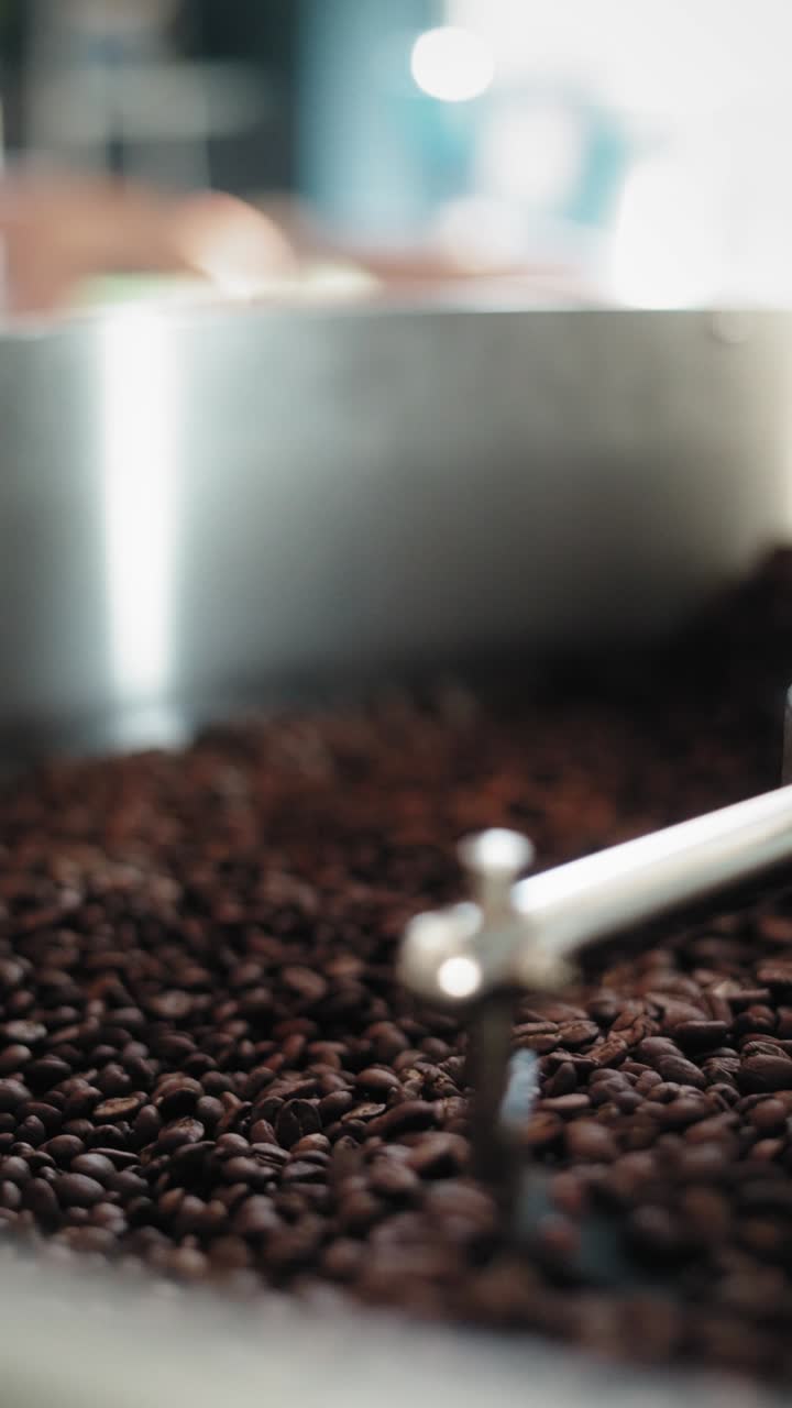Coffee Beans Turning in Roasting Drum Detail, Close Up View