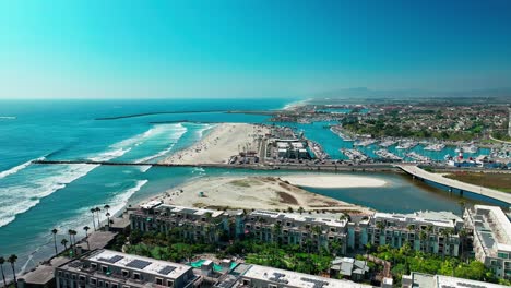 Marina-Harbor-in-Oceanside-California-drone-static-view-of-the-Pacific-Ocean-beaches-boats-and-jetties
