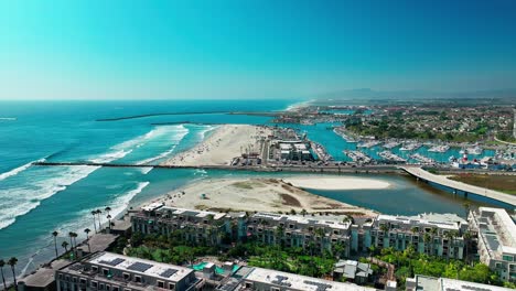 marina harbor in oceanside california drone static view of the pacific ocean beaches boats and jetties