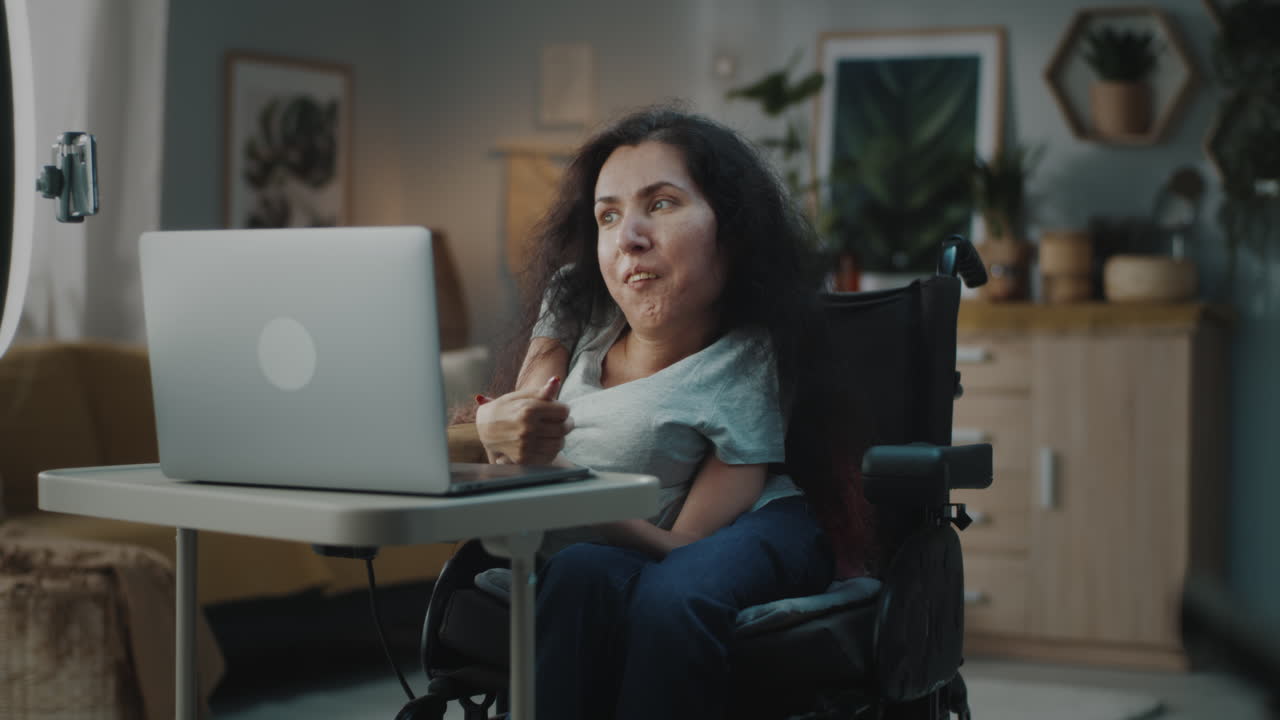 Woman in Wheelchair Vlogging or Video Conferencing