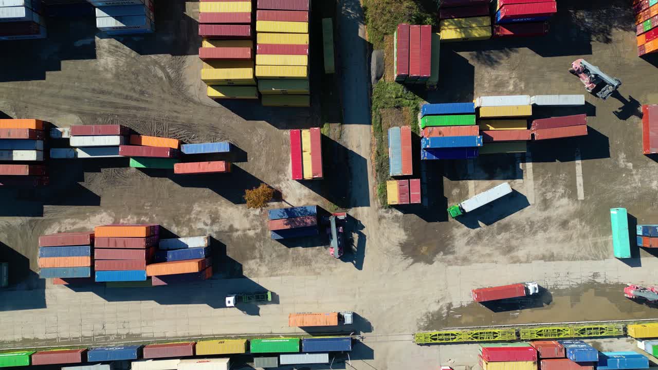 Aerial view of shipping containers, semi trucks cargo distribution of containers