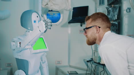 scientist interacting with a robot in a space laboratory