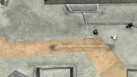 Top-down-aerial-view-of-the-Seattle-Center-skatepark-with-people-nearly-colliding