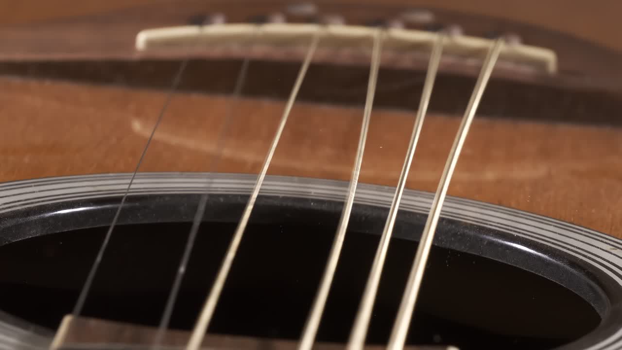 Acoustic guitar strings vibrating, Shot on super slow motion camera 1500 fps