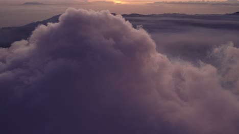 big gas cloud from active mount bromo vulcano indonesia at sunrise, aerial