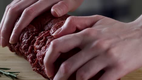 sliced cured beef on a wooden cutting board