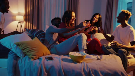 friends laughing together in bedroom