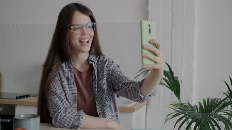 woman taking a selfie in her kitchen