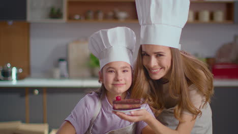 mother and daughter baking a cake