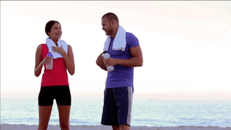 friends resting and drinking after a jogging