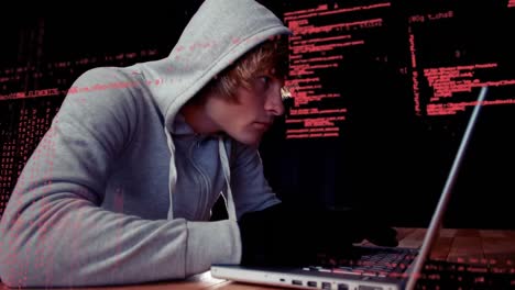 Animation-of-data-processing-over-caucasian-male-hacker-using-laptop