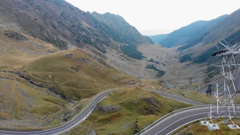 Aerial-shot,-drone-flying-over-Transfagarasan-mountain-and-winding-roads-in-Romania