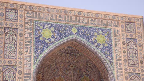 sun-light-hitting-the-tiled-archway-of-mosque-in-Samarkand,-Uzbekistan-along-the-historic-Silk-Road