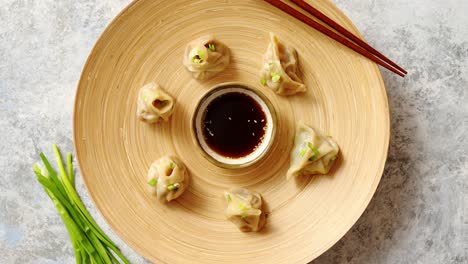 Delicious-chinese-dumplings-served-on-wooden-plate