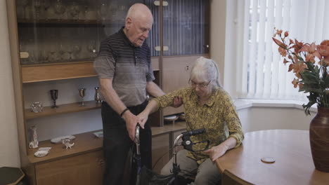 elderly couple at home with walker