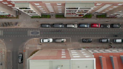 Aerial-birds-eye-overhead-top-down-tracking-view-of-cyclist-riding-on-cycle-route-in-centre-of-town.-Street-changed-to-bike-highway.-Promoting-green-transport-in-city.-Berlin,-Germany.