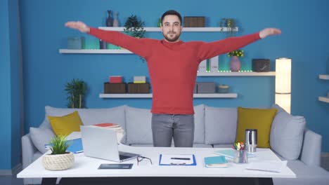 Young-businessman-showing-how-to-exercise-in-the-office.-They-relax-by-doing-standing-arm-exercises.