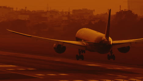 airplane landing on airstrip airport releasing white smoke clouds , front view slow motion close up