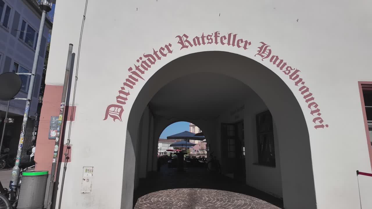 Darmstadt brewery, walking on the sunny street with people towards one of the famous brewery. Hessen Germany