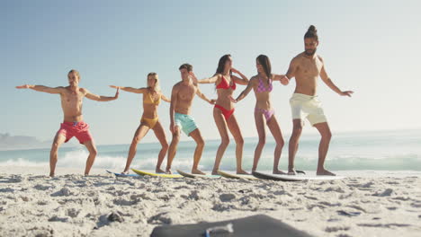 friends training surf styling on the sand