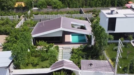 fly over rural village countryside luxury villa house with pool and garden in summer season in middle east the modern contemporary architecture design in the town the panoramic scenic landscape