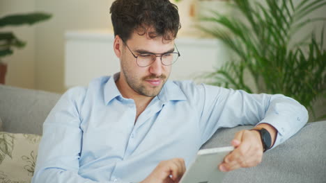 Businessman-Works-Remotely-on-Tablet