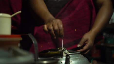 indonesian woman making a traditional homemade tea at the kitchen. - closeup shot