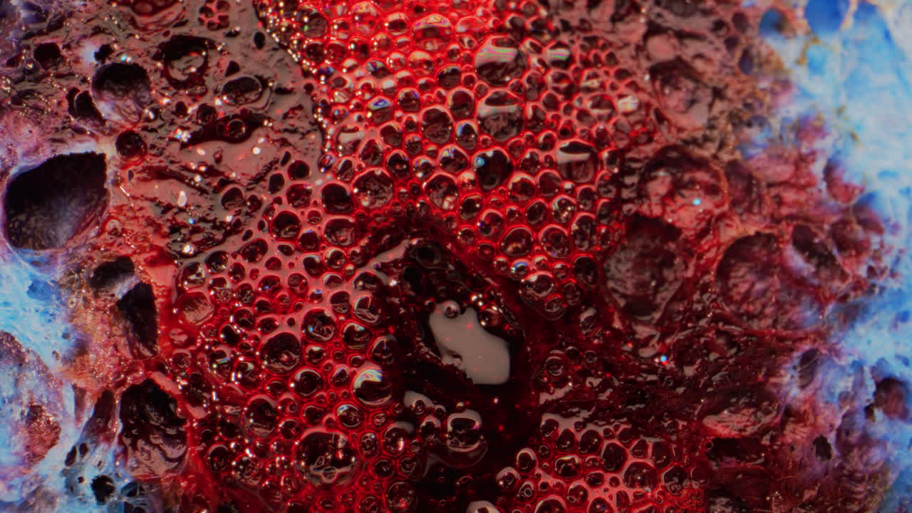 Abstract Macro Photography of Red Liquid Bubbles on a Surface