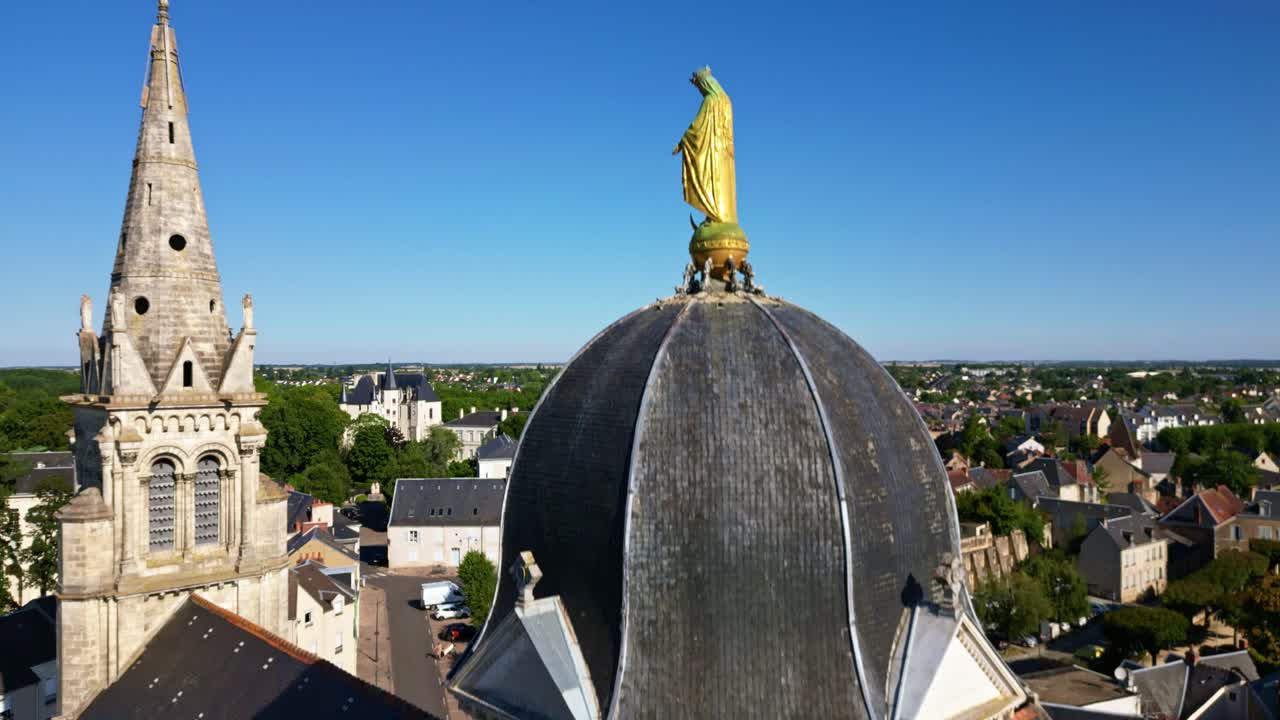 Église Notre-Dame de Châteauroux, Close-up of dome and spire of historic church, France. Aerial drone ascending