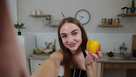 POV-shot-of-blogger-girl-making-photos,-taking-selfies-for-social-media-on-mobile-phone-at-kitchen