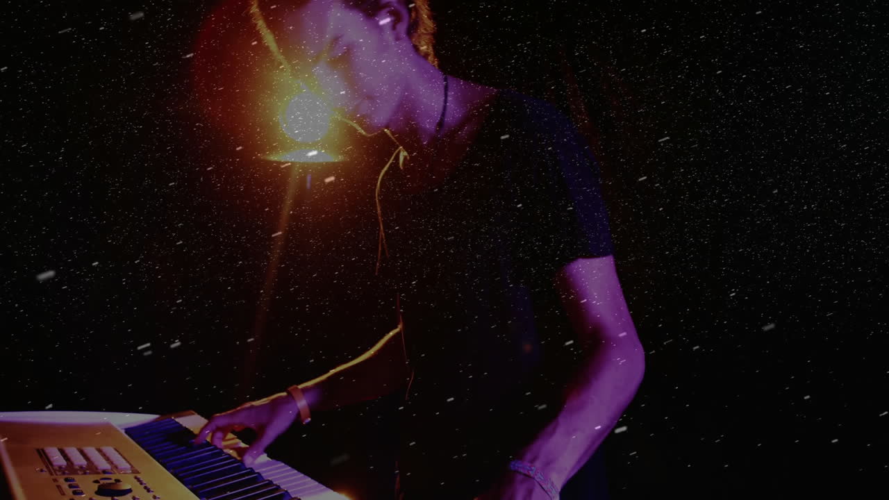 Male musician playing keyboard on stage, with animated technology overlays and floating particles