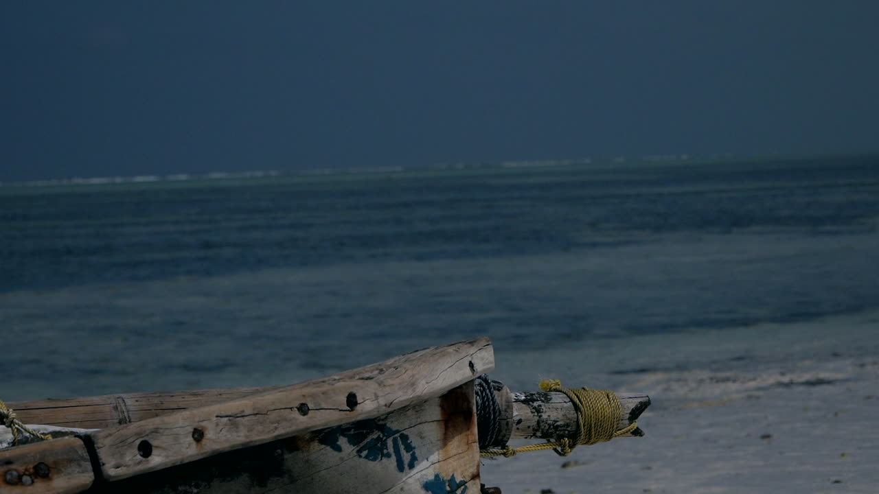 a lonely wooden boat by the sea. turquoise water in Indian ocean