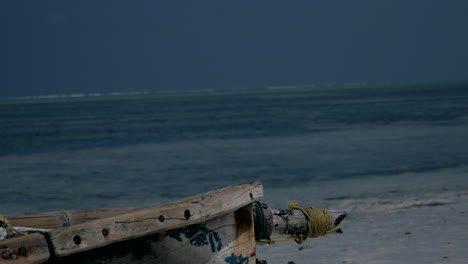 a lonely wooden boat by the sea. turquoise water in indian ocean