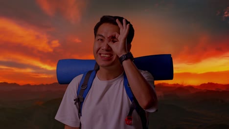 happy traveler at sunrise/sunset in the mountains
