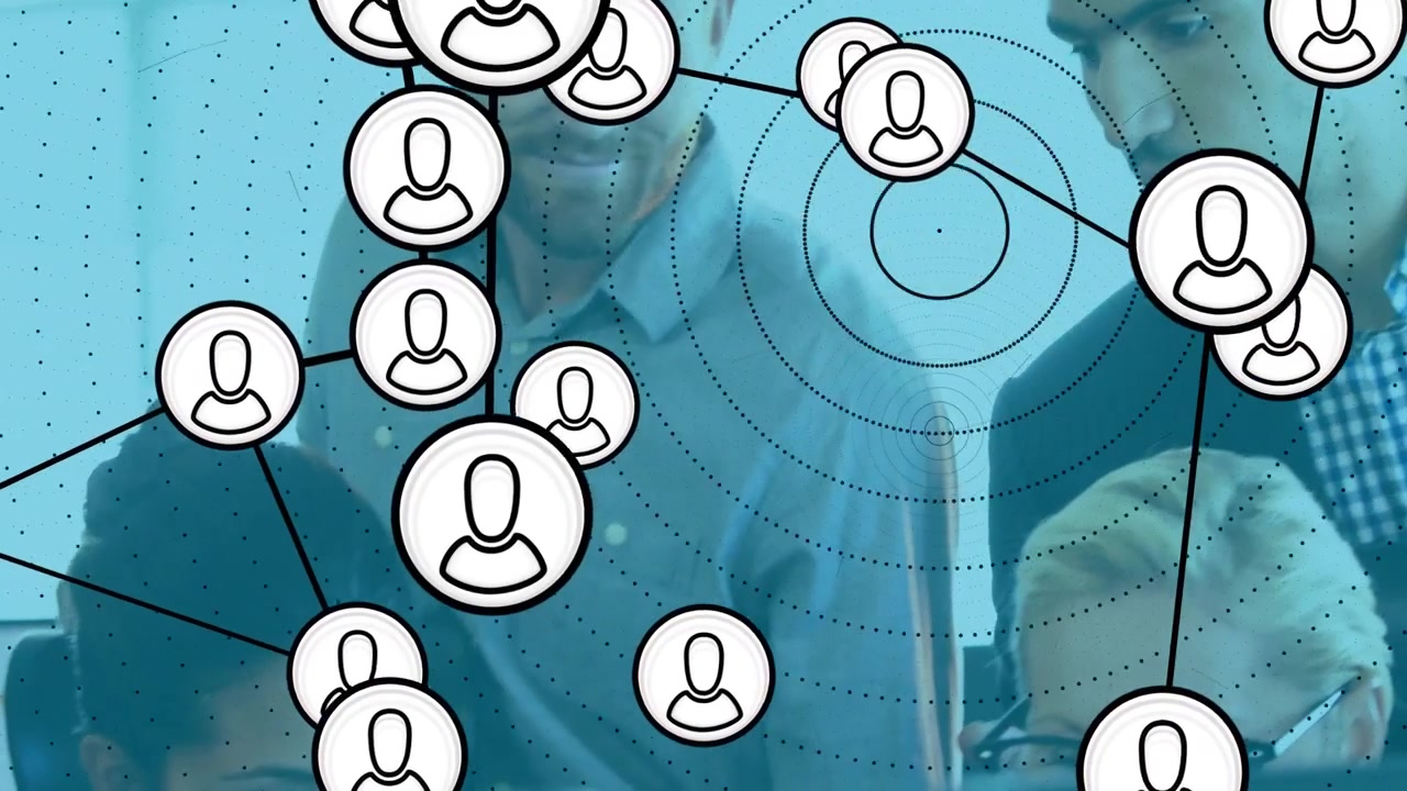 Tech team pointing at monitor and initiating animated network overlay linking user profiles