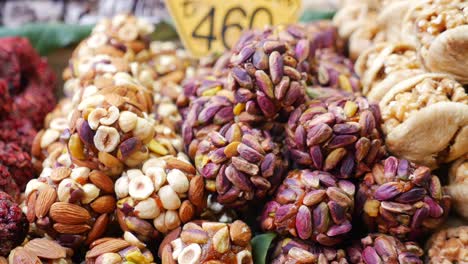 close-up of assorted nuts and dried fruits at a market