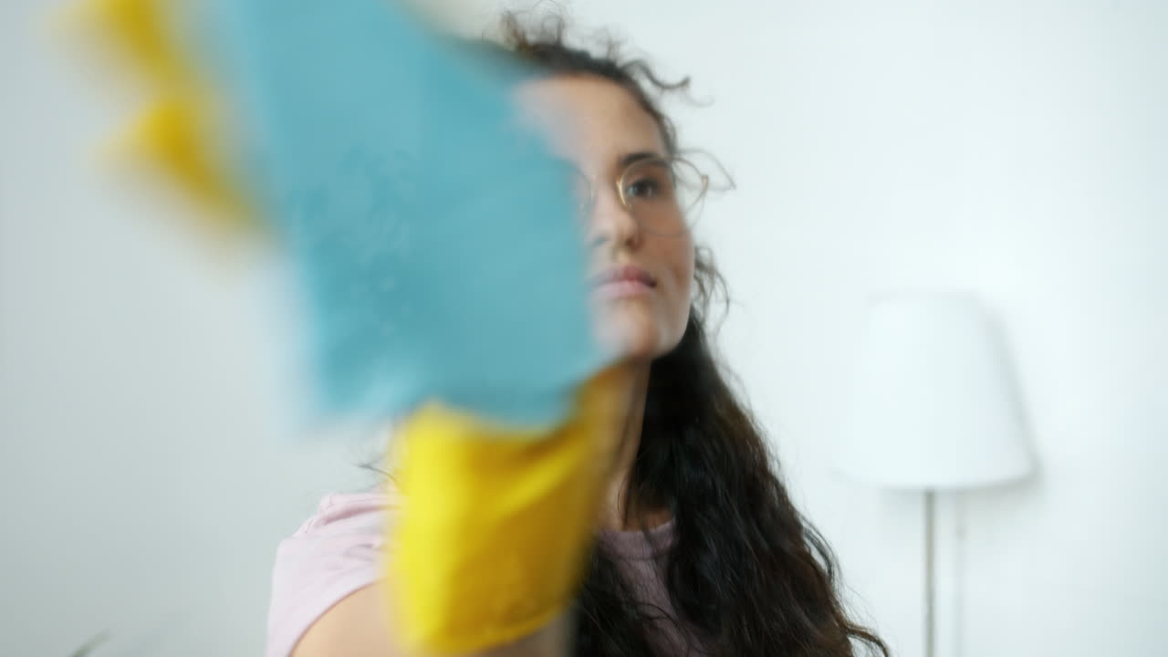 Woman cleaning window