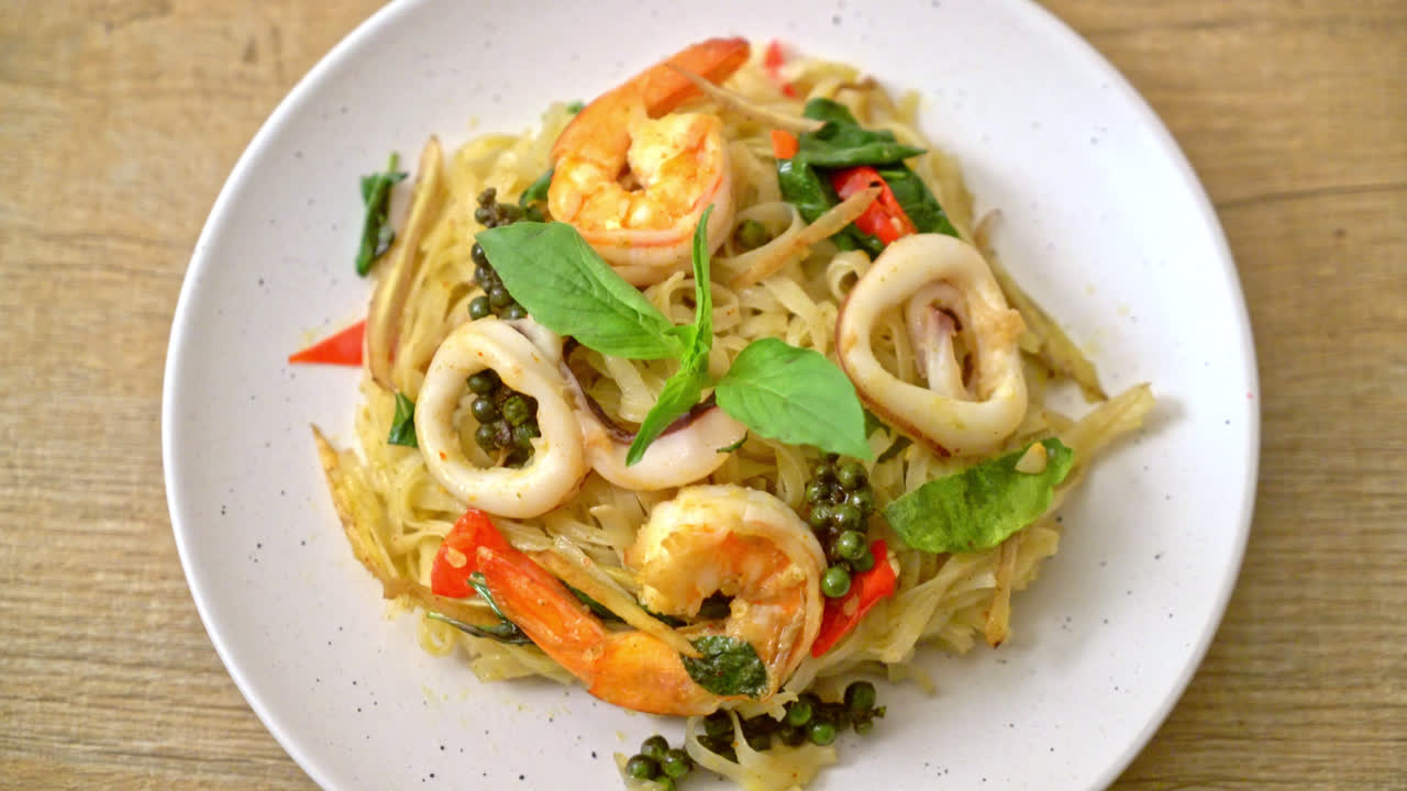 stir fried spicy noodles with sea food (Pad Cha Talay) - Thai food style