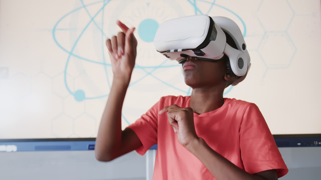 Using VR headset, boy engaging in virtual reality experience in school classroom