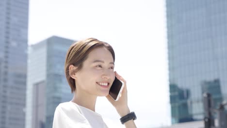 a woman talking on a smartphone