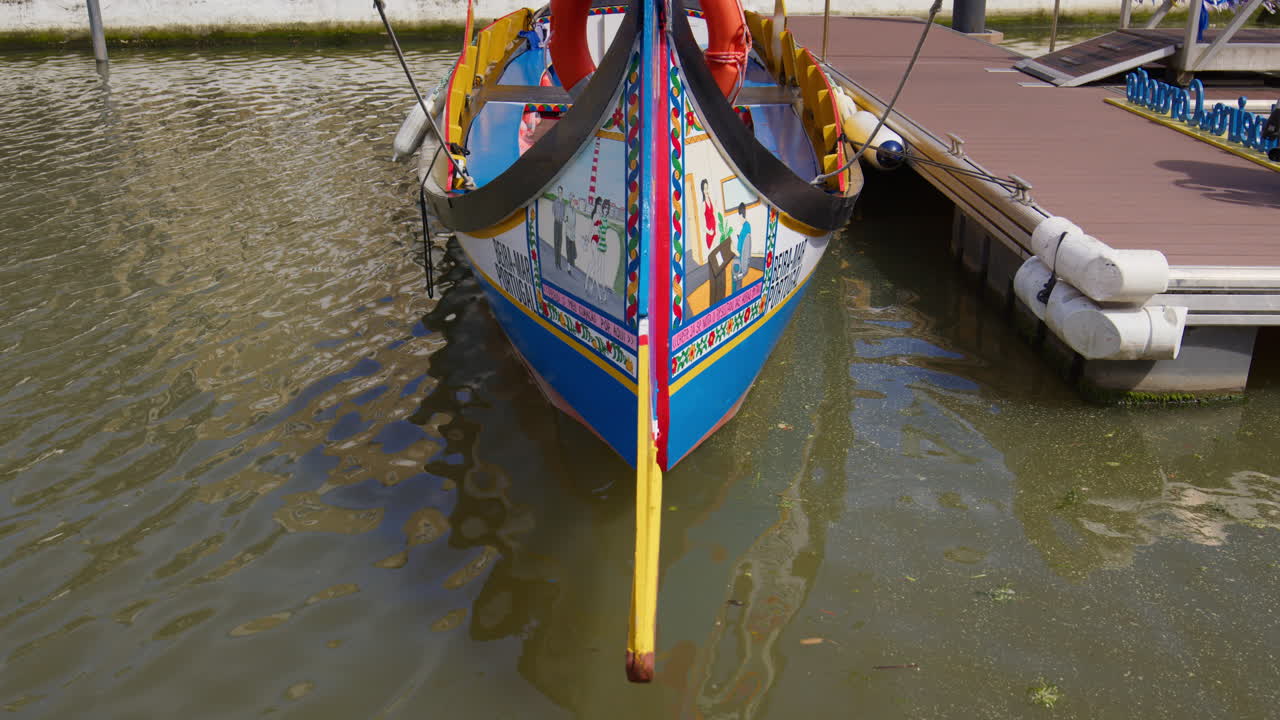 Dock Colorful Moliceiro Traditional Boat On The Canals In Aveiro, Portugal. Close-up Shot