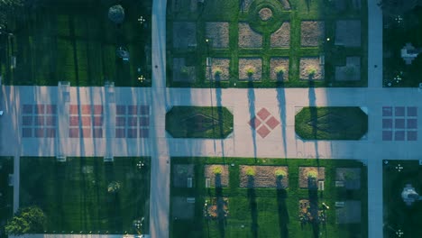 aerial top down drone shot of symmetrical sidewalks and trees in civic park denver