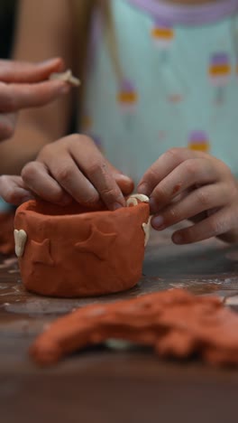 children making pottery