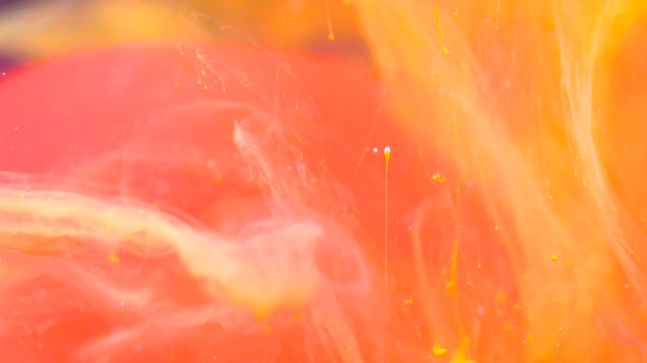 yellow color drop in pink water