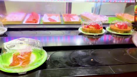 sushi plates moving on a conveyor belt